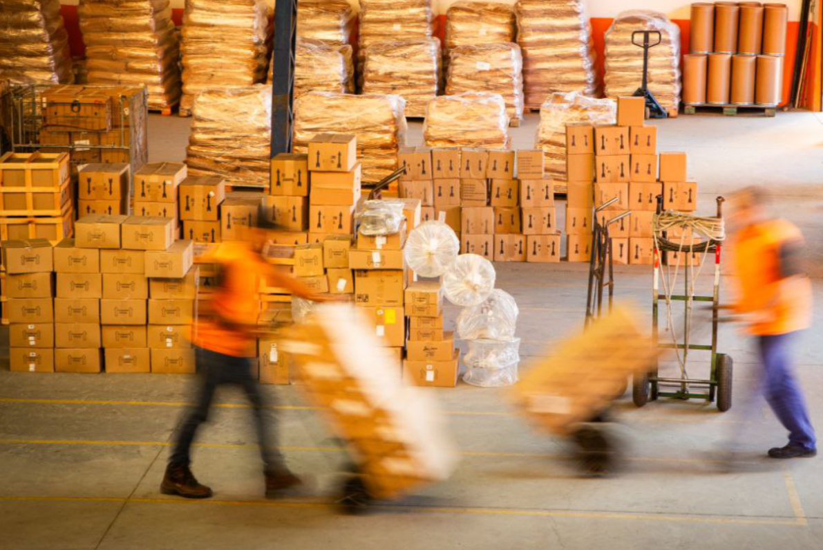young man-working-warehouse-with-boxes.jpeg